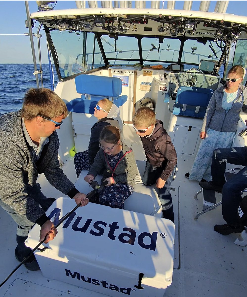 A family fishing together on a Sir Walleye Charters Lake Erie walleye trip - kids welcome