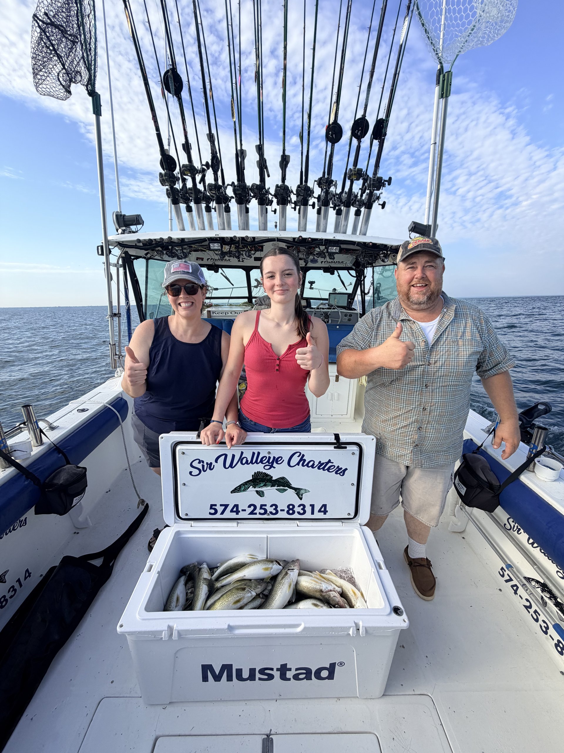 Happy Sir Walleye Charters clients with a cooler full of Lake Erie Central Basin walleye - July 14 2026