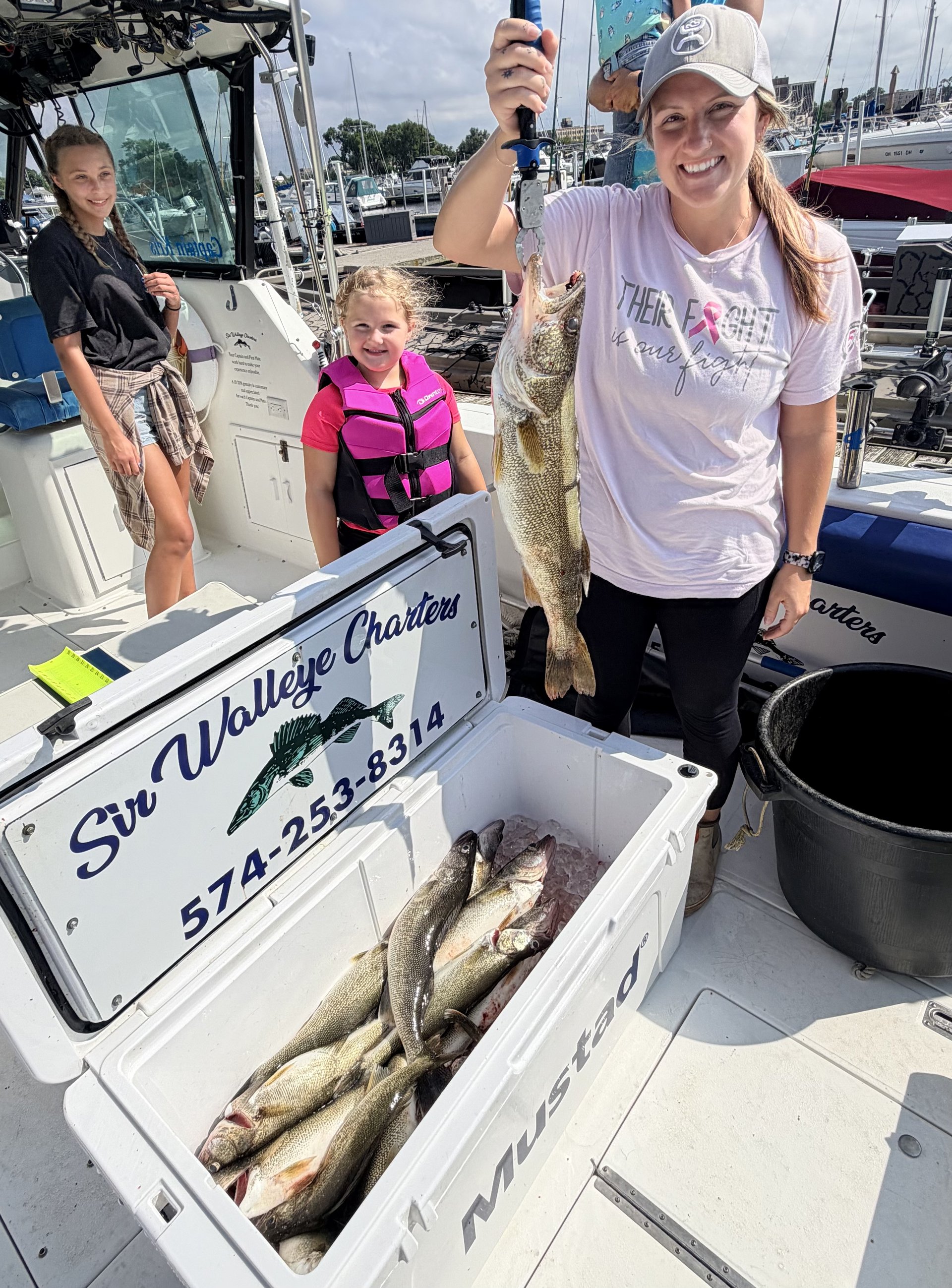 Lake Erie walleye held up boatside by a Sir Walleye Charters client - July 14 2026
