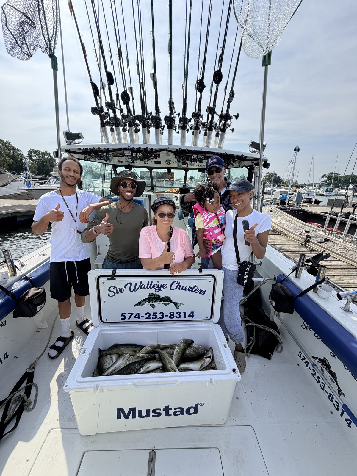 Family of Sir Walleye Charters clients with their Lake Erie walleye catch - kids and women welcome