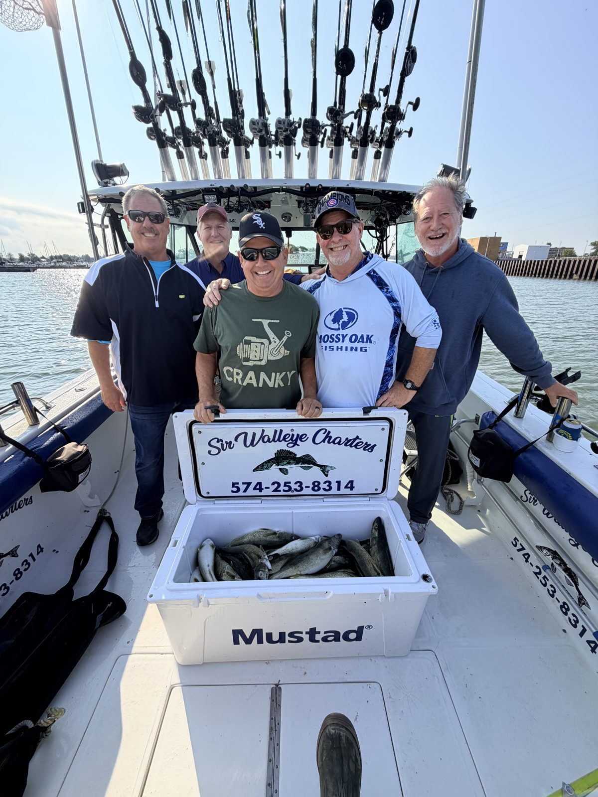 Sir Walleye Charters charter group with a cooler of Central Basin Lake Erie walleye