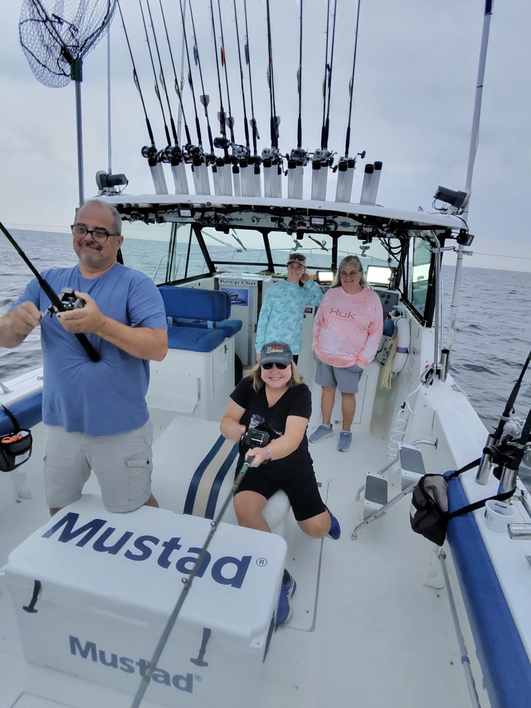 Anglers working the rods for Lake Erie walleye aboard Sir Walleye Charters out of Lorain