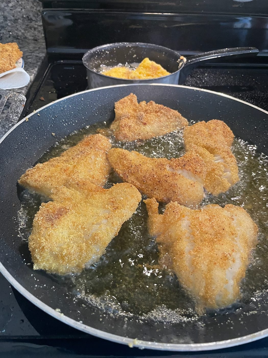 Fresh Lake Erie walleye fillets frying up after a Sir Walleye Charters trip out of Lorain