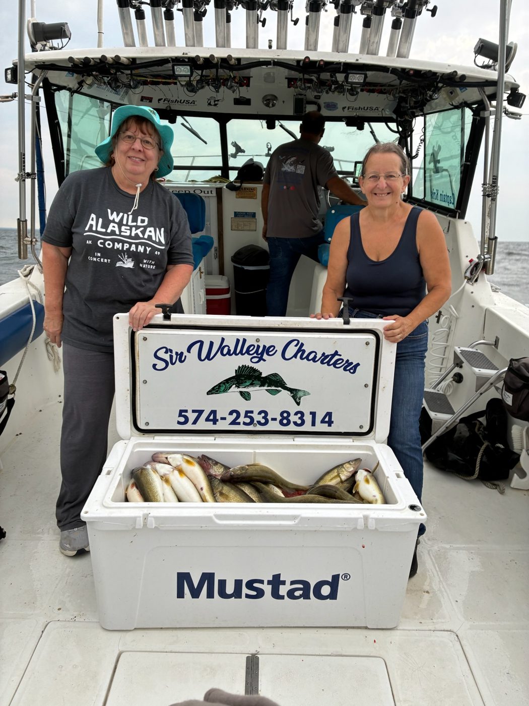 Sir Walleye Charters clients with a cooler of Central Basin Lake Erie walleye out of Lorain
