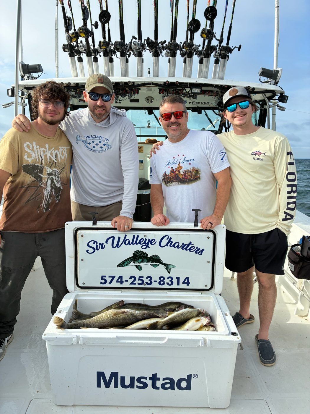 Sir Walleye Charters group with a cooler of Central Basin Lake Erie walleye out of Lorain, Ohio