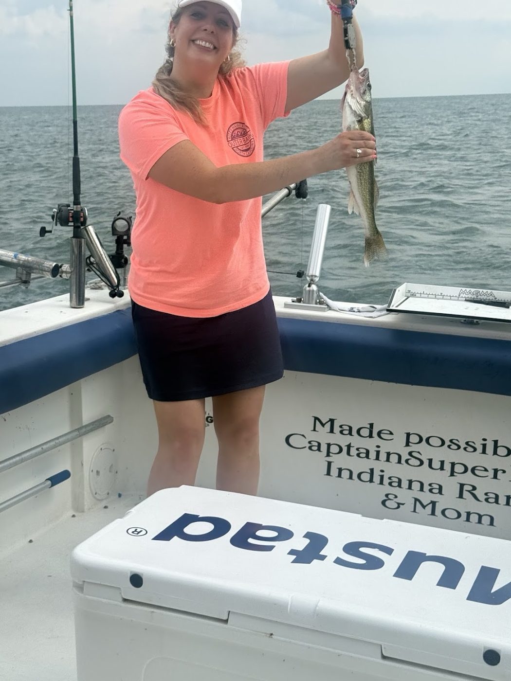 Sir Walleye Charters client holding a quality Central Basin Lake Erie walleye caught shoreline out of Lorain, Ohio, August 2026
