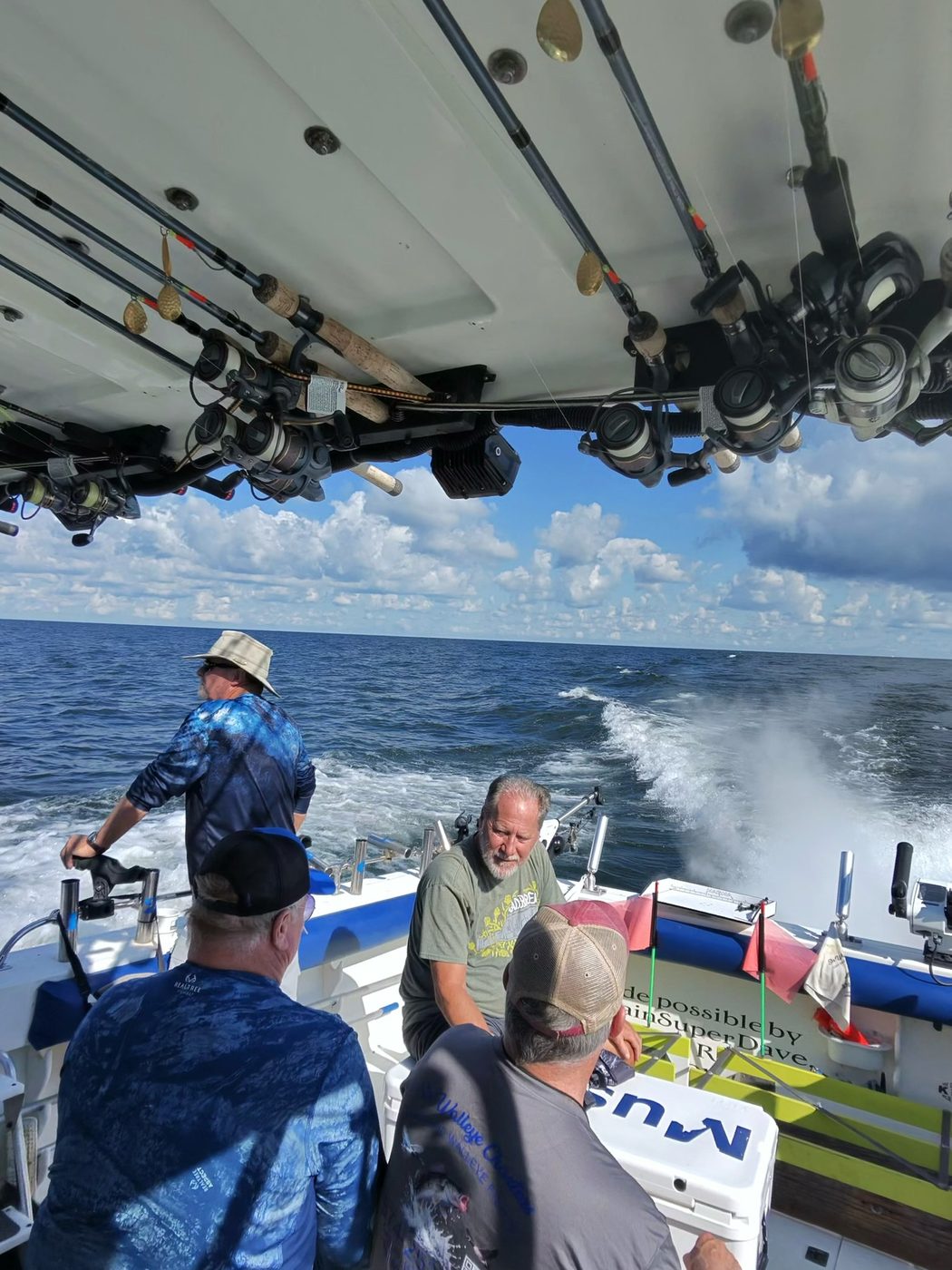 Sir Walleye Charters trolling under a full rack of rods on the long run to deep Central Basin walleye water on Lake Erie