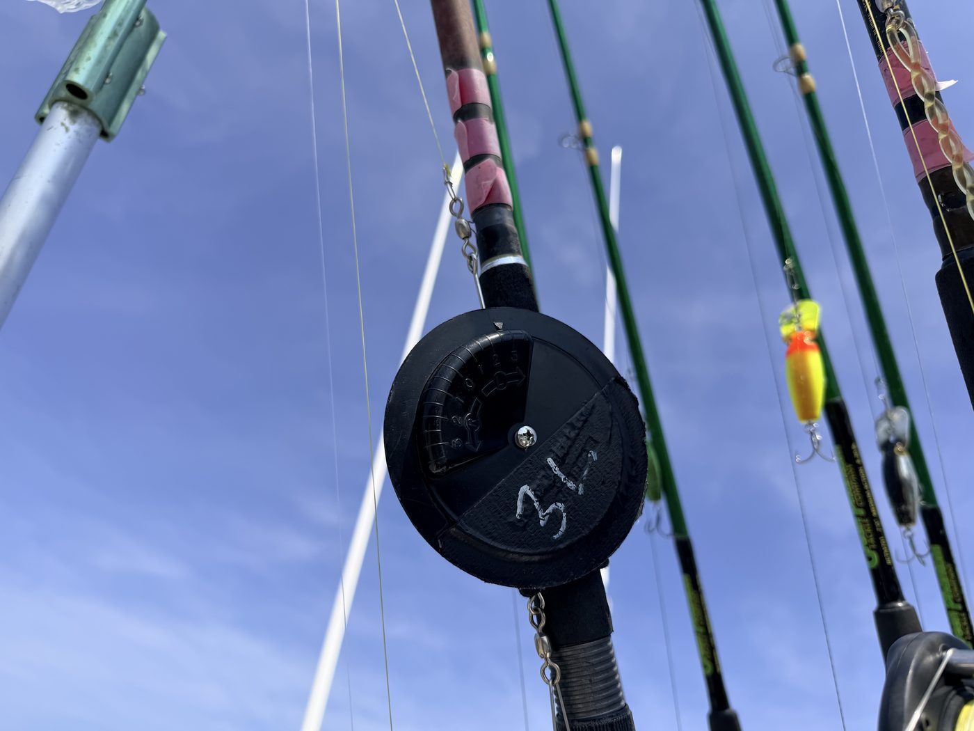 Figure 1 - a Dipsy Diver, the round disk-shaped diving device used to take walleye trolling lures deeper on Lake Erie