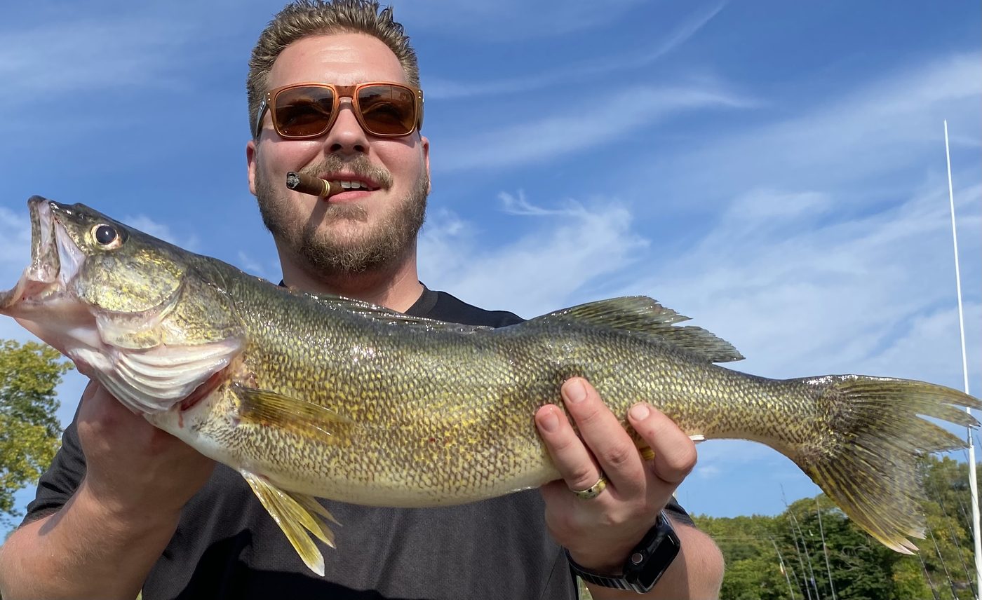 Angler holding a big fall Central Basin Lake Erie walleye caught with Sir Walleye Charters out of Lorain, Ohio
