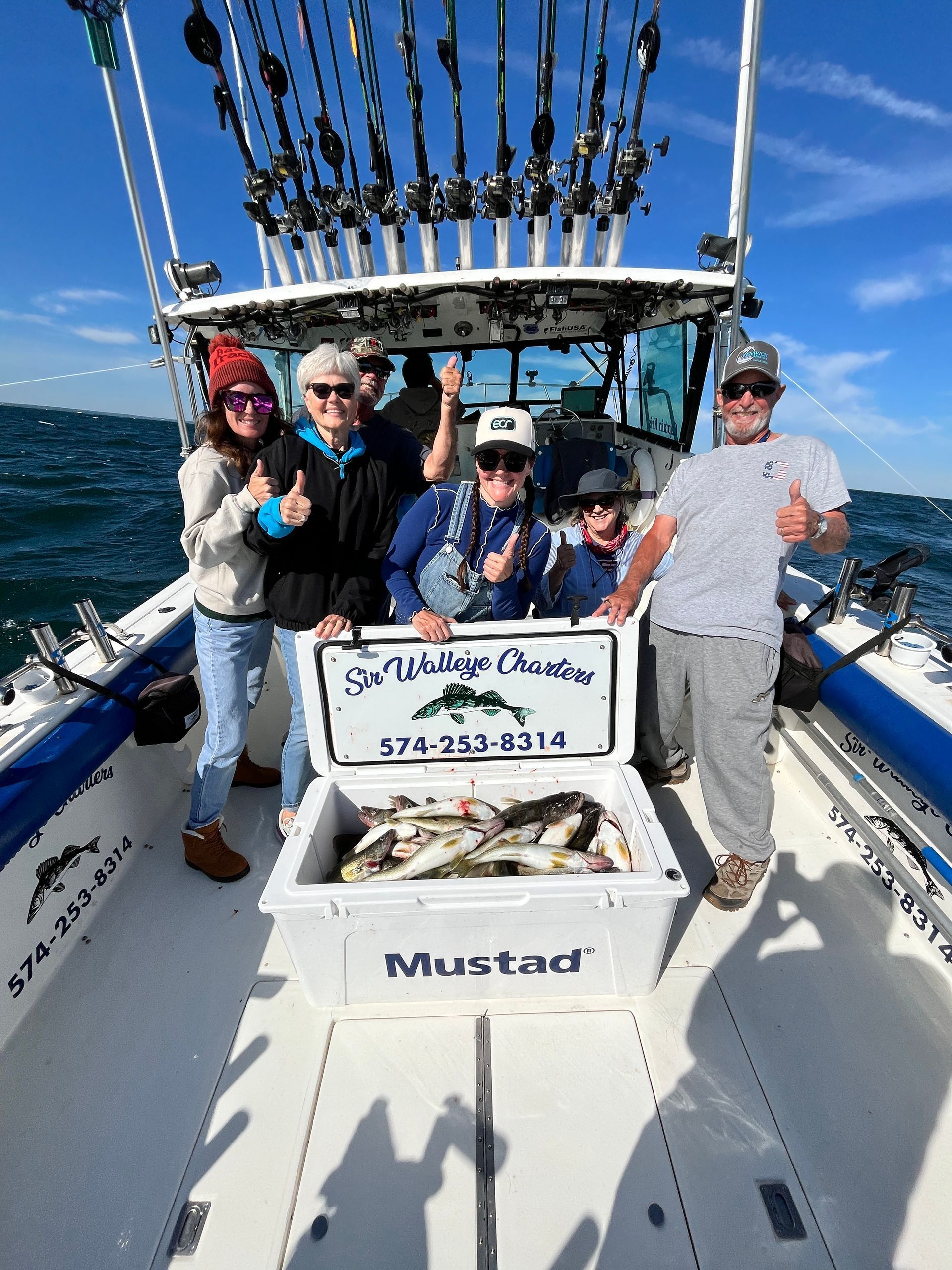 Family group with a cooler full of Lake Erie Walleyes.