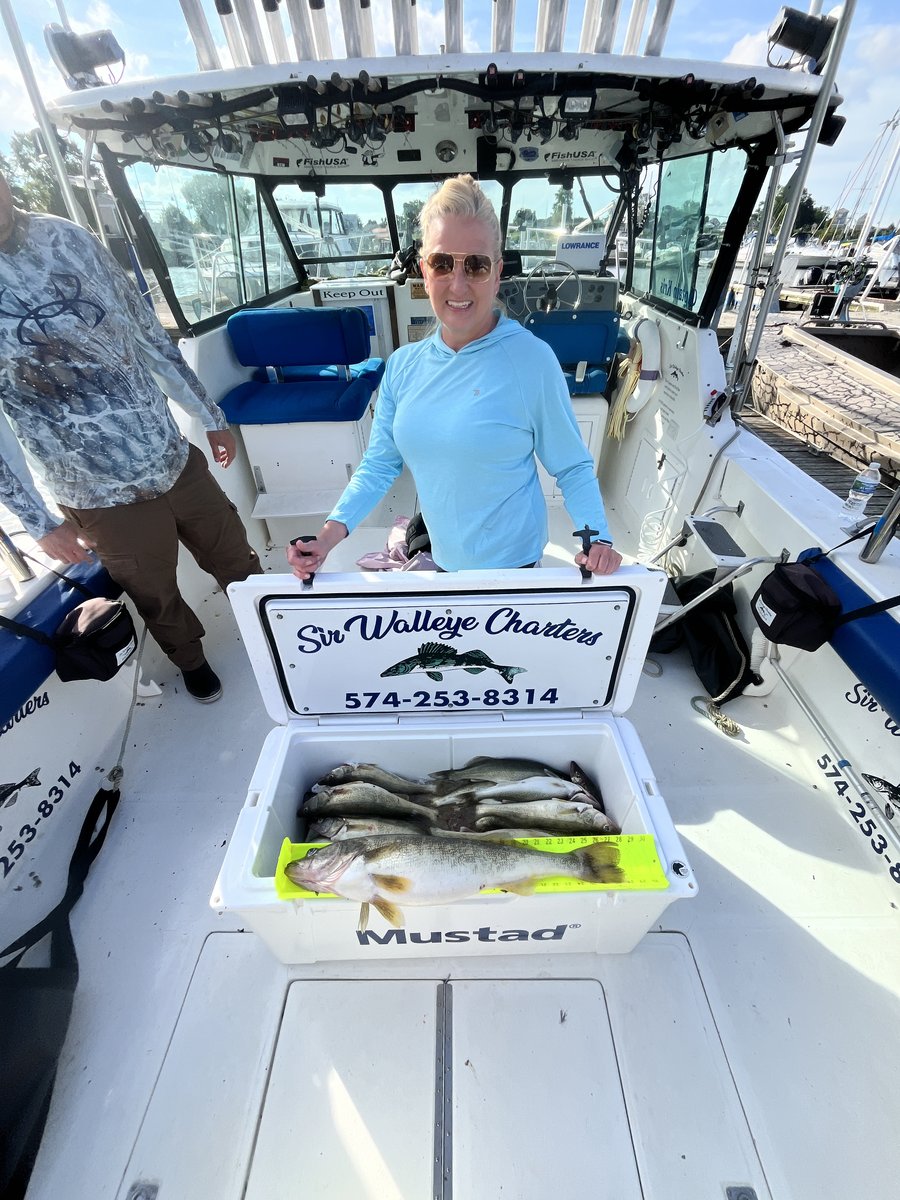 An angler with a cooler of trophy Lake Erie walleye on a Sir Walleye charter